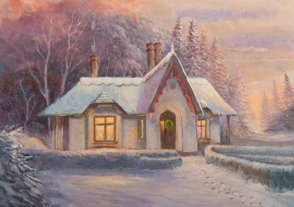 Charming winter scene of Deenagh Lodge, Co. Kerry, with snow-covered roof and festive wreath on the door
