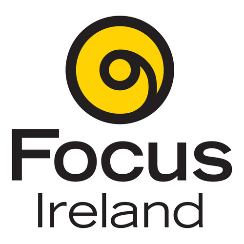 Yellow and black logo featuring a spiral design with the text "Focus Ireland" below, related to Irish Christmas Cards