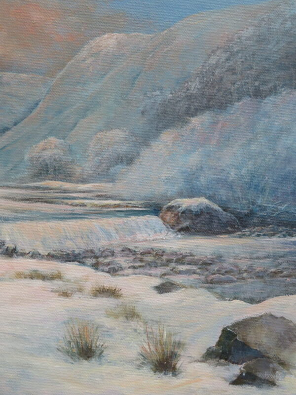Snow-covered landscape featuring Ashleigh Falls and the River Erriff, with mountains and a serene, cloudy sky