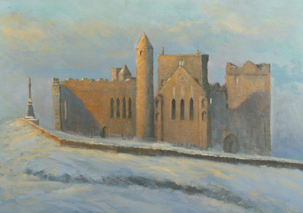 Historic Rock of Cashel with stone buildings and a tower, set against a soft, cloudy sky, ideal for a Christmas card