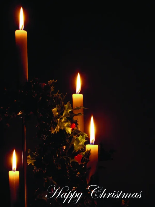 Four lit candles surrounded by holly leaves, with "Happy Christmas" elegantly written below on a dark background