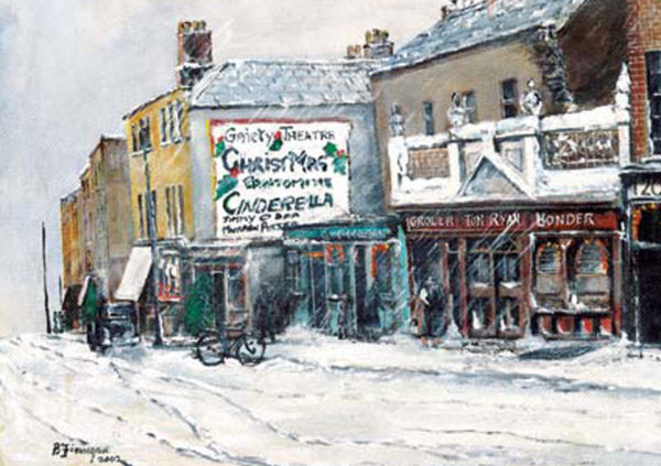 Snow-covered street scene in Dublin, featuring the Gaiety Theatre with a "Cinderella" sign and nearby shops