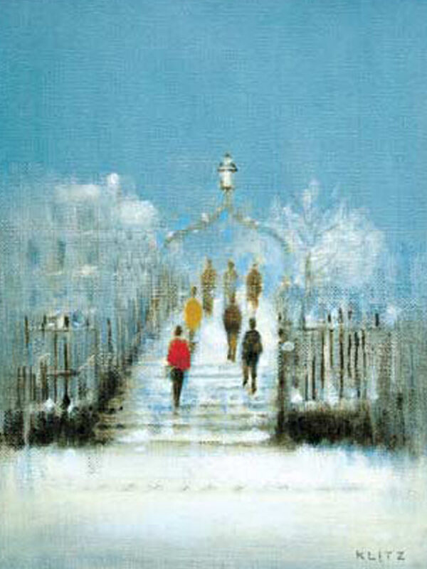Snowy scene of Ha'penny Bridge with people walking up steps, framed by trees and a blue sky above