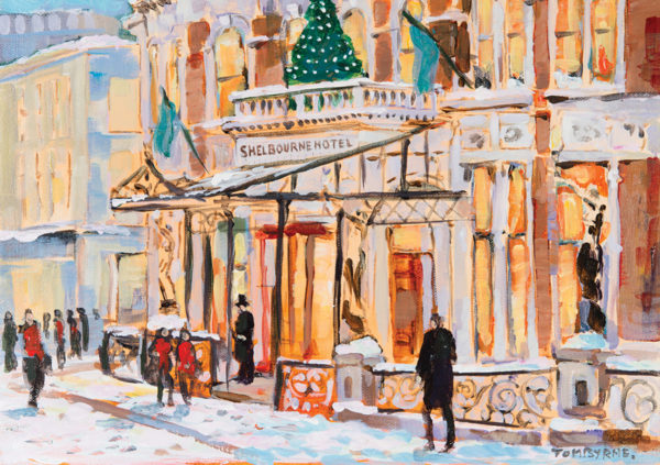 Snow-covered entrance of The Shelbourne Hotel, adorned with a Christmas tree, surrounded by people in winter attire